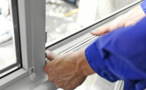 Man Putting Weather Strips in Place